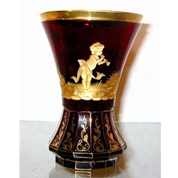 Engraved glass cup. Bottom part is cut into facets